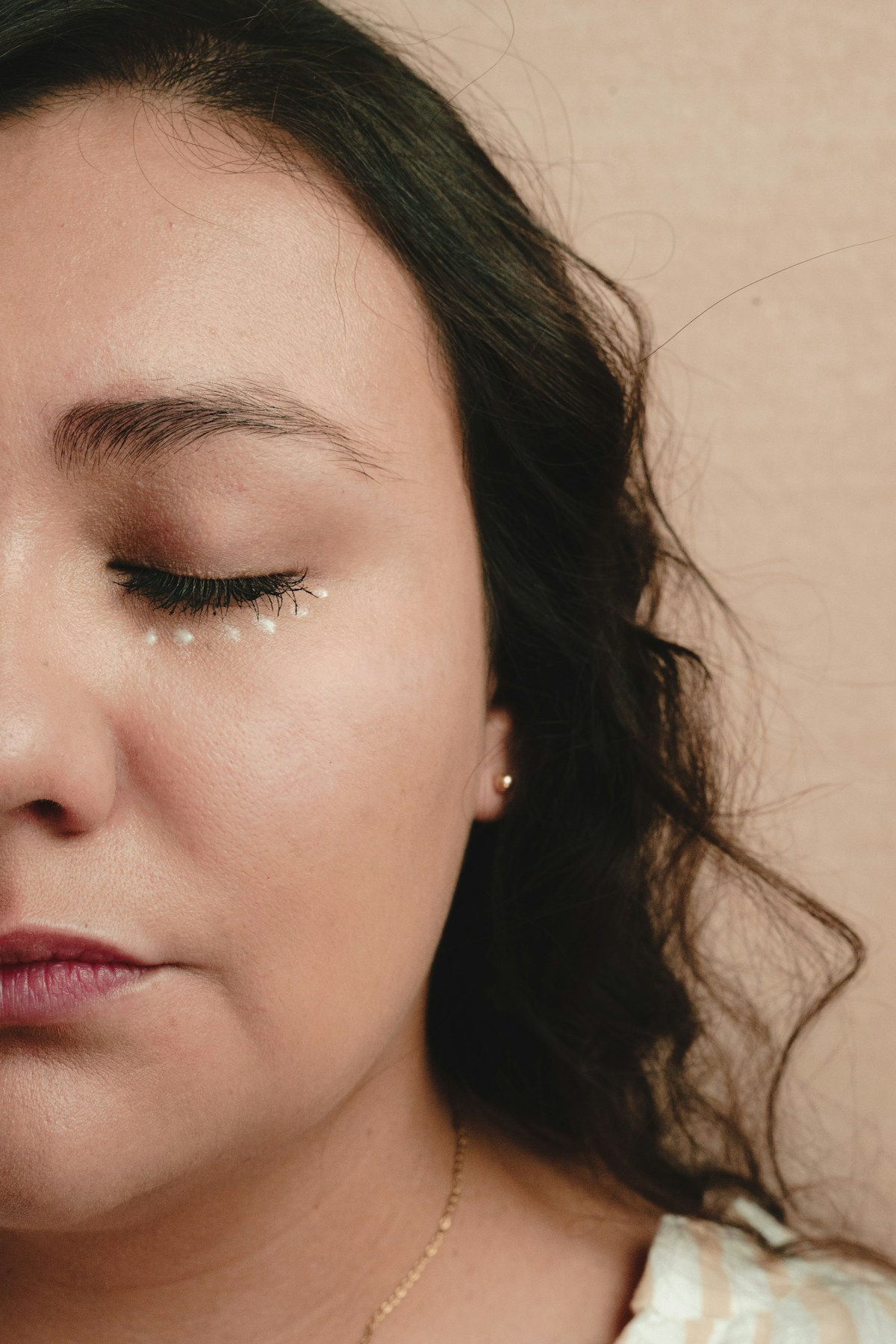 Close-up portrait of a woman with her eyes gently closed