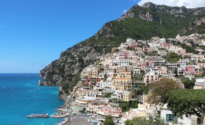 Positano’s pastel buildings climbing above the Amalfi Coast