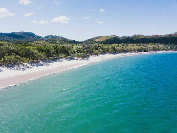 Aerial view of Playa Conchal and its forested shore in Guanacaste