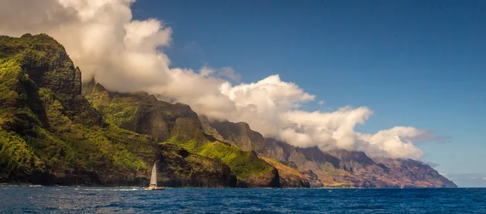 Sculpted green ridges above the ocean along Kauaʻi’s Nā Pali Coast