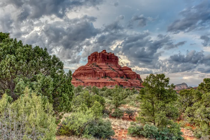 Bell Rock surrounded by desert greenery near Sedona
